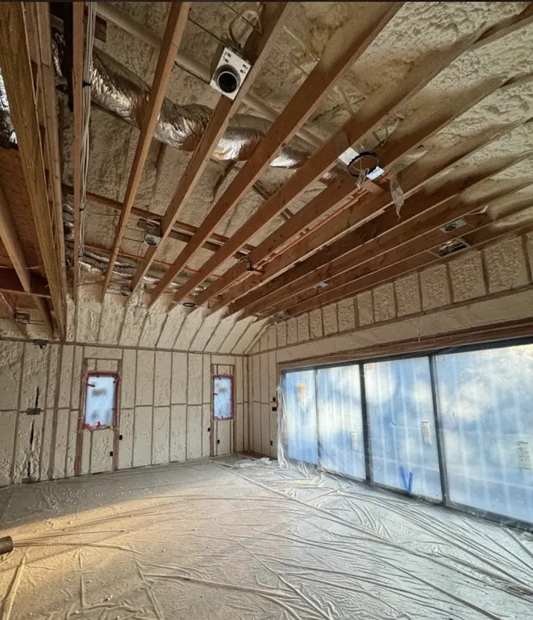 Interior walls and ceiling insulated with spray foam during new construction in Randolph Town